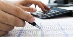 Accounting Services in Brunswick, Maine - Person calculating taxes
